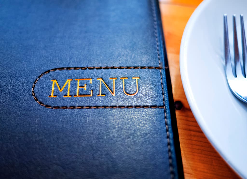 Printed catering menus on a table